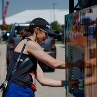 A racer grabbing some Kona Ice.